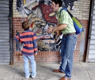 Matt explaining wheatpastes to two kids in Meatpacking District